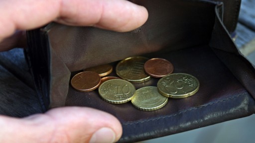 Münzen in einem Geldbeutel (Foto:picture alliance / dpa | Karl-Josef Hildenbrand)